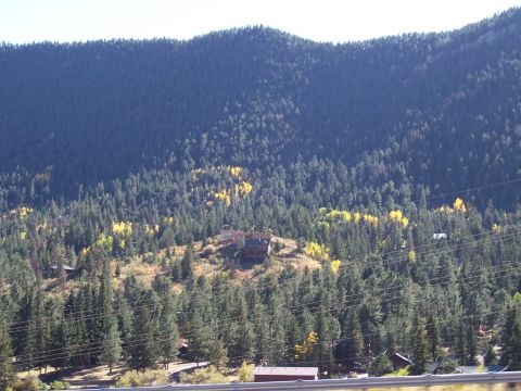 1972 Ford Ranchero - A scenic view of a mountain landscape dotted with houses and a mix of evergreen and autumn-colored trees.