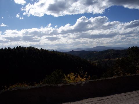 1972 Ford Ranchero - A scenic view of rolling hills and distant mountains under a dramatic sky.