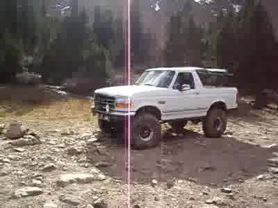 1996 Ford Bronco - Shadofax goes up the rock and slips a tire off the edge.