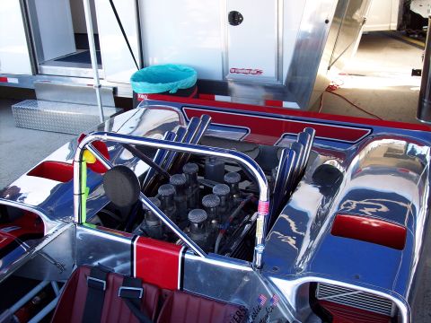 1971 Ford Mustang - Close-up of a custom race car's engine bay, chrome details and exposed engine components.