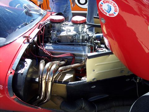1971 Ford Mustang - Engine bay details with a prominent V8 motor and a racing team sticker.