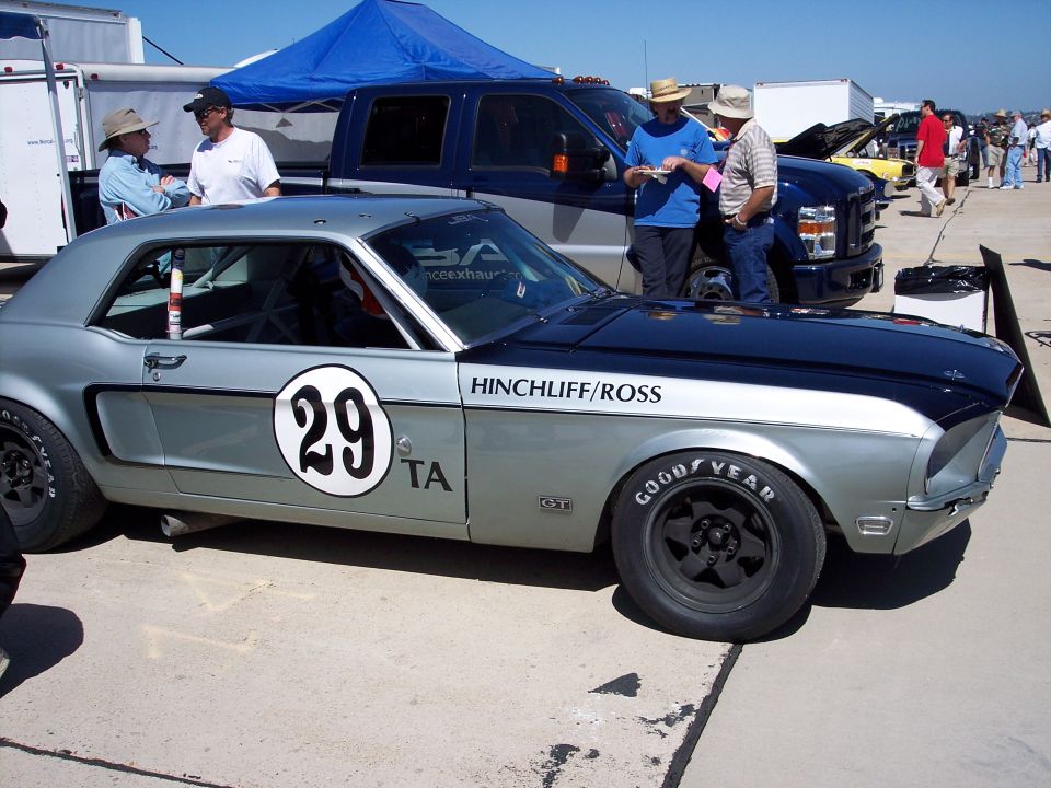 Silver and black race car with number 29 on door, Goodyear tires, and Hinchliff/Ross text