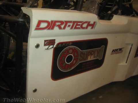 1990 Ford Bronco - white race car body panel displaying red Dirt-Tech lettering and a Rod End Supply sponsor decal.