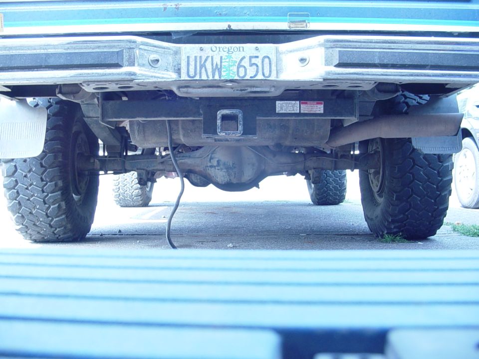 Truck rear bumper with Oregon license plate UKW 650, trailer hitch, and exhaust pipe