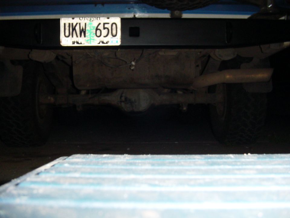 Underbody rear of blue truck with Oregon license plate UKW 650 and exhaust