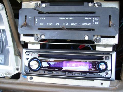 1979 Ford F-100 - Vehicle interior showing climate controls and an aftermarket Kenwood stereo unit.