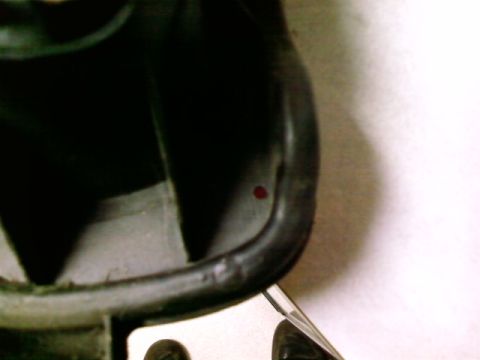 1995 Ford Bronco - Close-up view of a black interior component with a distinct red mark.