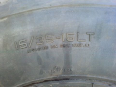 1995 Ford Bronco - The tire sidewall displays its size and recommended rim dimensions.