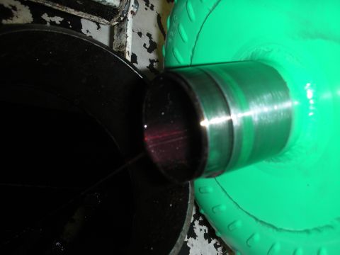 1992 Ford Crown Victoria - Close-up of a transmission component, showing a metal cylinder with internal red coloring.