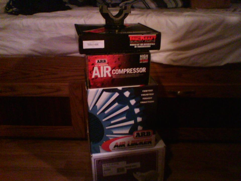 Stack of ARB Air Compressor and Air Locker boxes, with a True-Kraft box on top