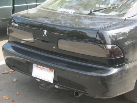 1995 Ford Bronco - Rear view of a black Acura Integra, showing its taillights and license plate.