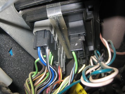 1995 Ford Bronco - Close-up view of a vehicle's interior wiring harness and electrical connectors.