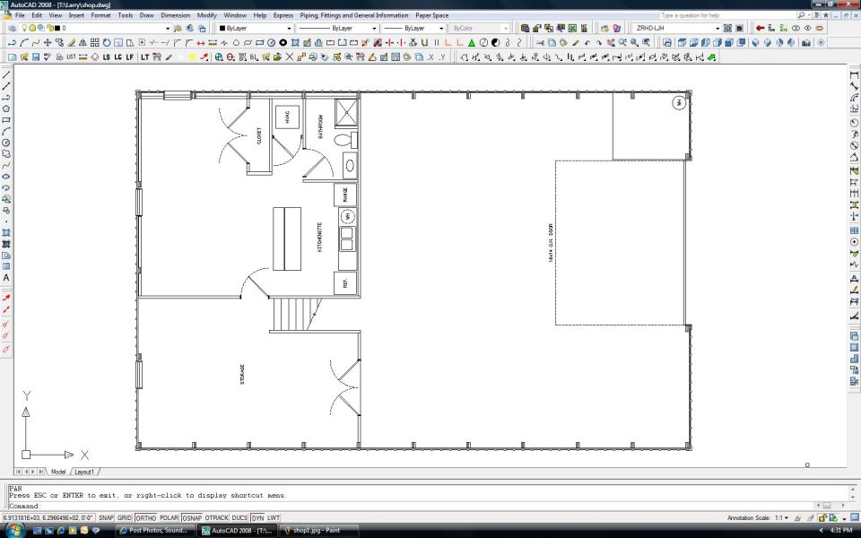 AutoCAD screenshot of a dimensioned building floor plan with rooms, bath, stairs, and open shop area