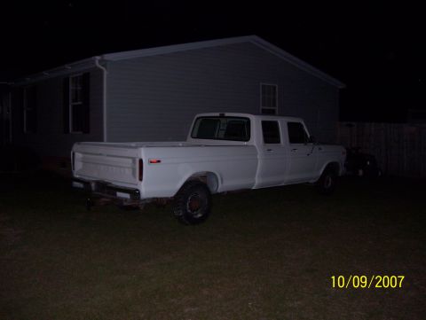 1978 Ford Bronco - This 1978 Ford F-350 crew cab pickup truck is seen parked in a yard at night.