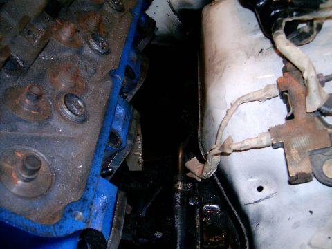 1978 Ford Mustang II - Close-up view of engine components, including a blue gasket and electrical wiring.