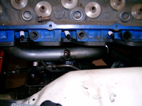 1978 Ford Mustang II - Close-up view of engine exhaust headers, showing the metal pipes and associated engine components.
