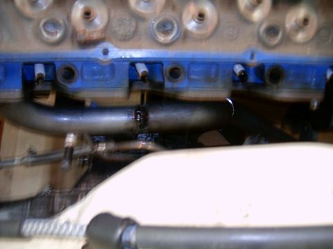 1978 Ford Mustang II - Close-up view of an engine block with blue paint and exhaust headers, showing welded pipework.