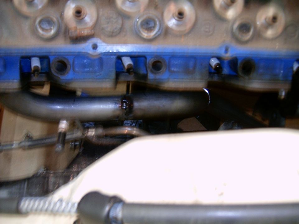 Engine block with blue paint and exhaust headers