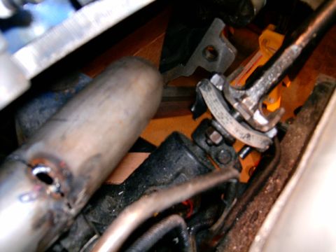 1978 Ford Mustang II - Detail of exhaust pipe and steering linkage components, likely from a vehicle's undercarriage.