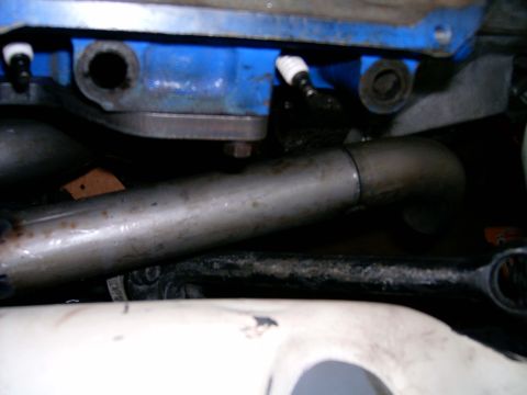 1978 Ford Mustang II - Exhaust pipe and engine block detail.