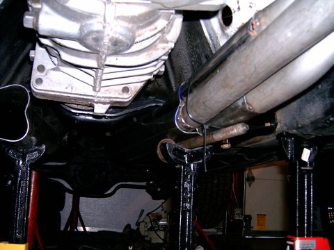 1978 Ford Mustang II - Underside view of exhaust headers and transmission, likely from a vehicle on jack stands.