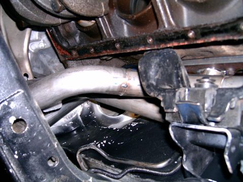 1978 Ford Mustang II - Close-up view of custom exhaust headers and engine components, showing metalwork and structural elements.