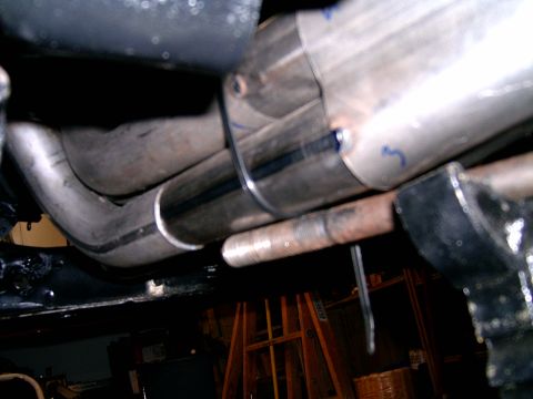 1978 Ford Mustang II - Close-up view of vehicle exhaust system components, including headers and pipes.