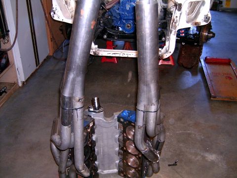 1978 Ford Mustang II - Custom exhaust headers are shown attached to a V8 engine block, likely undergoing installation or modification.