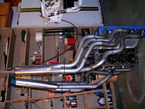 1978 Ford Mustang II - Custom exhaust headers and mufflers fitted to an engine block, likely for a project car.