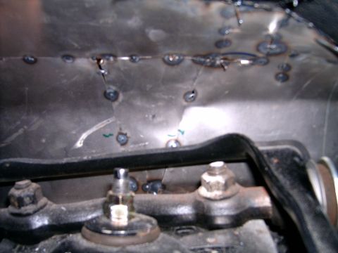 1978 Ford Mustang II - Welded metal panel with fasteners, likely part of a vehicle's undercarriage or engine bay.