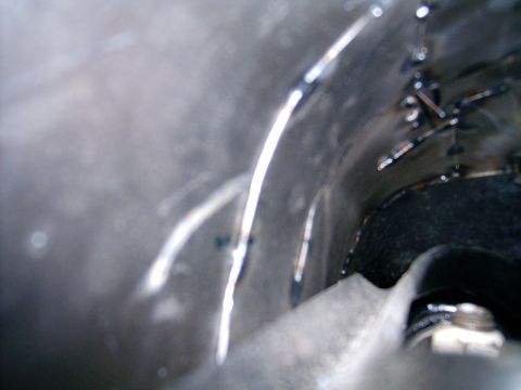 1978 Ford Mustang II - Close-up view of welded metal components, possibly from a vehicle's exhaust or undercarriage.
