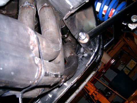 1978 Ford Mustang II - Custom exhaust headers are visible along with suspension components, including a blue spring.