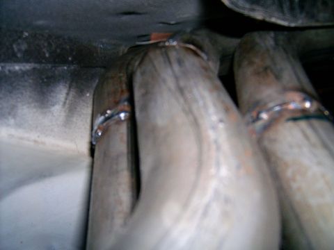 1978 Ford Mustang II - Close-up view of exhaust headers, showing welded connections and metal tubing.