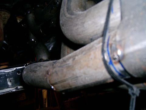 1978 Ford Mustang II - The photo shows a section of exhaust pipes, possibly from a vehicle's engine bay.