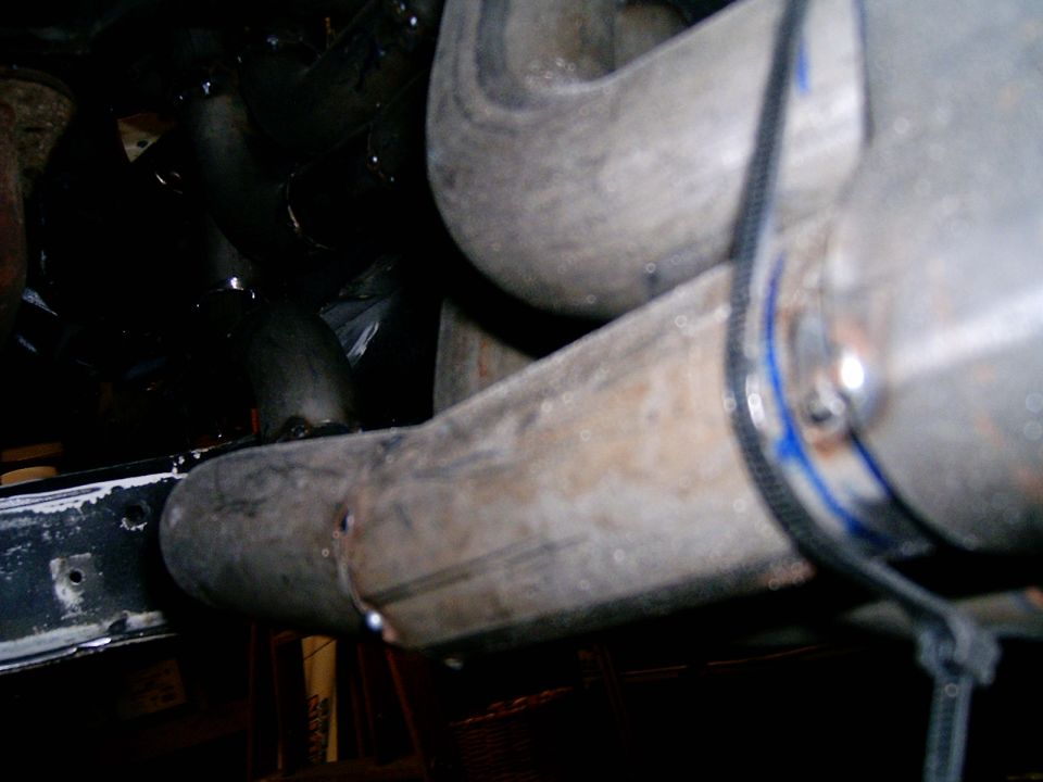close up of exhaust pipes and some engine components
