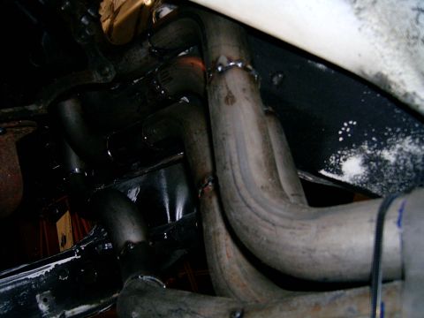 1978 Ford Mustang II - Close-up view of exhaust headers, showing welded joints and signs of wear.