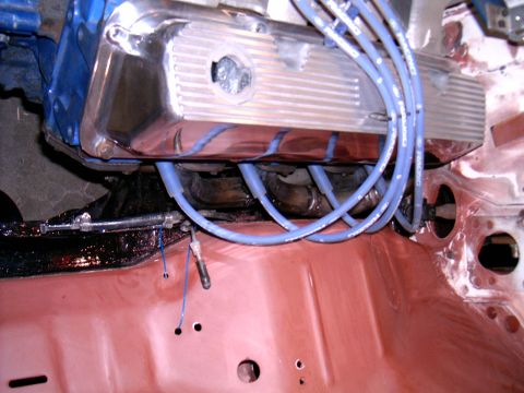 1978 Ford Mustang II - Close-up of engine components, including a chrome valve cover and blue spark plug wires.
