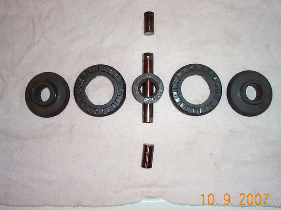 Differential bearings and pins laid out on a white cloth