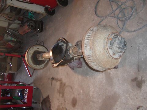 1991 Ford Bronco - Rear axle assembly with drum brakes and differential housing, likely for a truck or SUV.