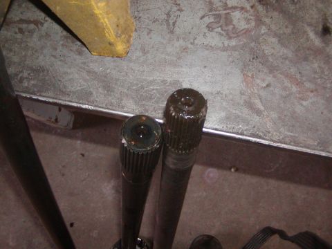 1991 Ford Bronco - Two axle shafts are shown, likely for a vehicle repair or upgrade project.