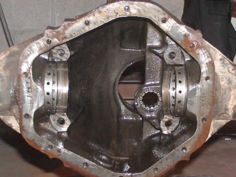 1991 Ford Bronco - Close-up view of a differential housing with bearing races, ready for assembly.