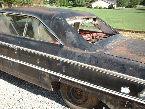 1963 Ford Galaxie - This 1963 Ford Galaxie is in rough condition with significant rust and missing components.