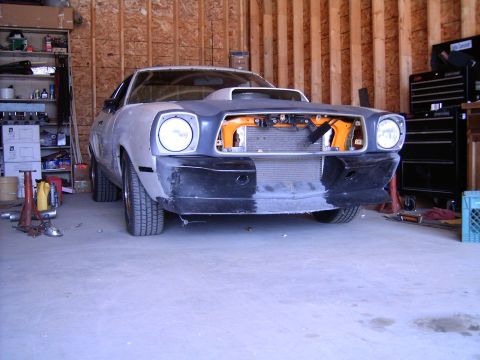 1978 Ford Mustang II - This 1978 Ford Mustang II is in a garage, appearing to be in the process of restoration or modification.