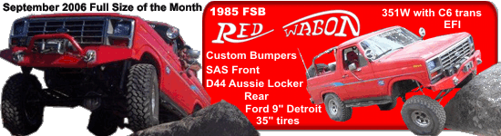 Red 1985 Ford Bronco with custom bumpers and off-road tires on rocks