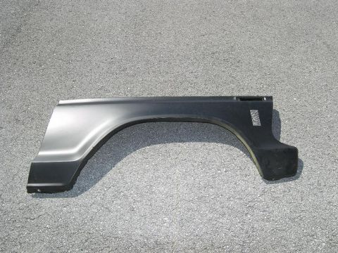 1974 Ford Bronco - This is a single automotive part, a rear fender flare, shown against an asphalt background.