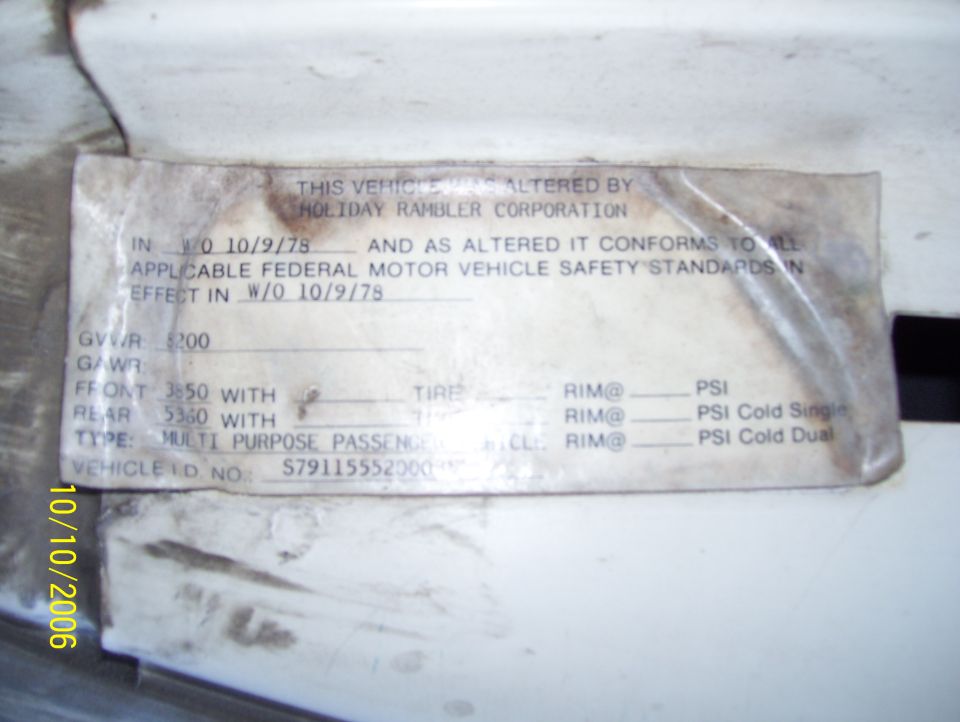 Weathered Holiday Rambler Corporation vehicle alteration label dated W/O 10/9/78 on a white door jamb