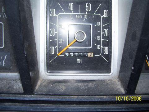 1978 Ford Bronco - Close-up of an analog speedometer reading in MPH (outer scale 10-80) and km/h (inner scale), with a mechanical odometer showing 53148.8 mil…