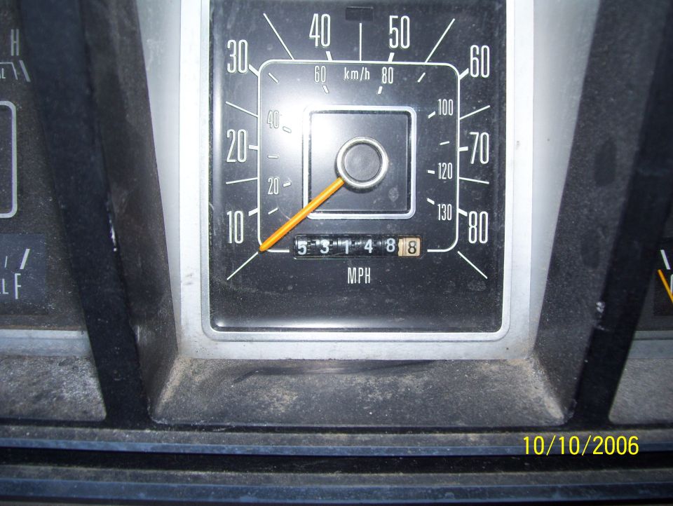 Speedometer gauge with MPH and km/h scales and odometer reading 53148.8