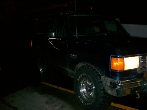 1988 Ford Bronco - This 1988 Ford Bronco is seen from the front quarter angle in a dark setting.