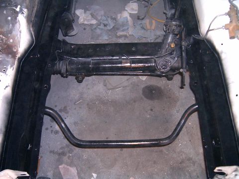 1978 Ford Mustang II - Underside view of a vehicle's steering rack and suspension components.